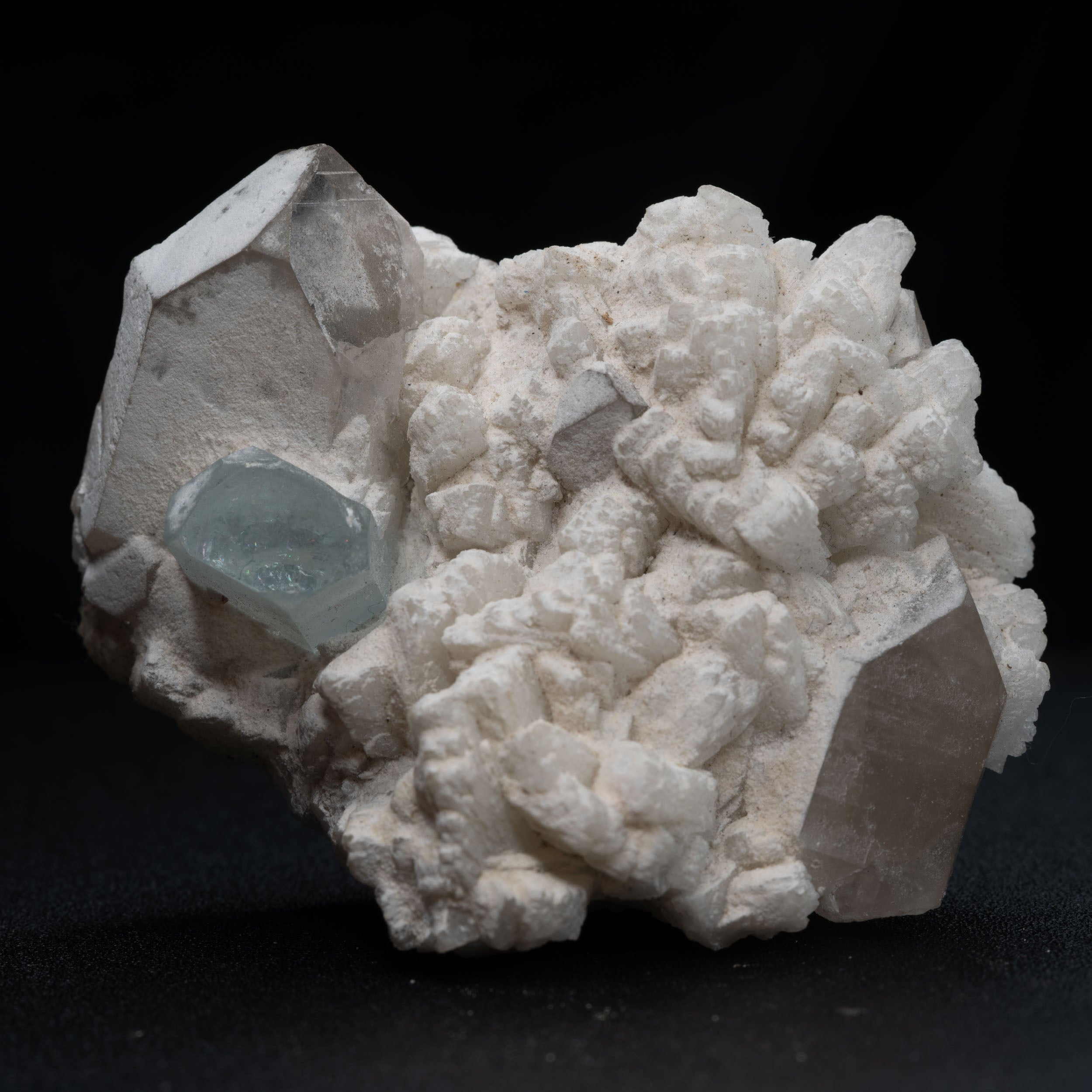 Aquamarine Nestled in Snow-White Albite with Smoky Quartz & Garnet Accents
