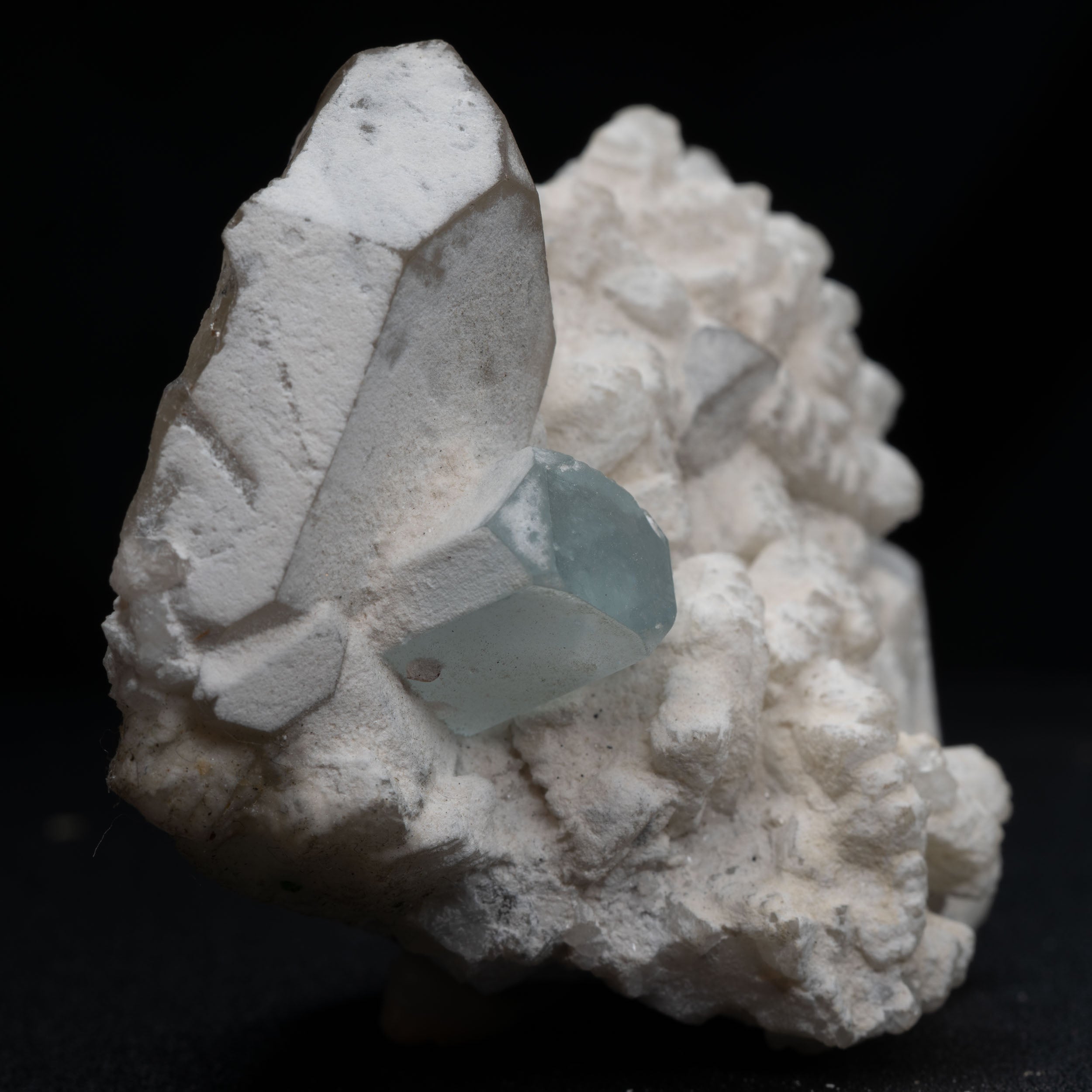 Aquamarine Nestled in Snow-White Albite with Smoky Quartz & Garnet Accents