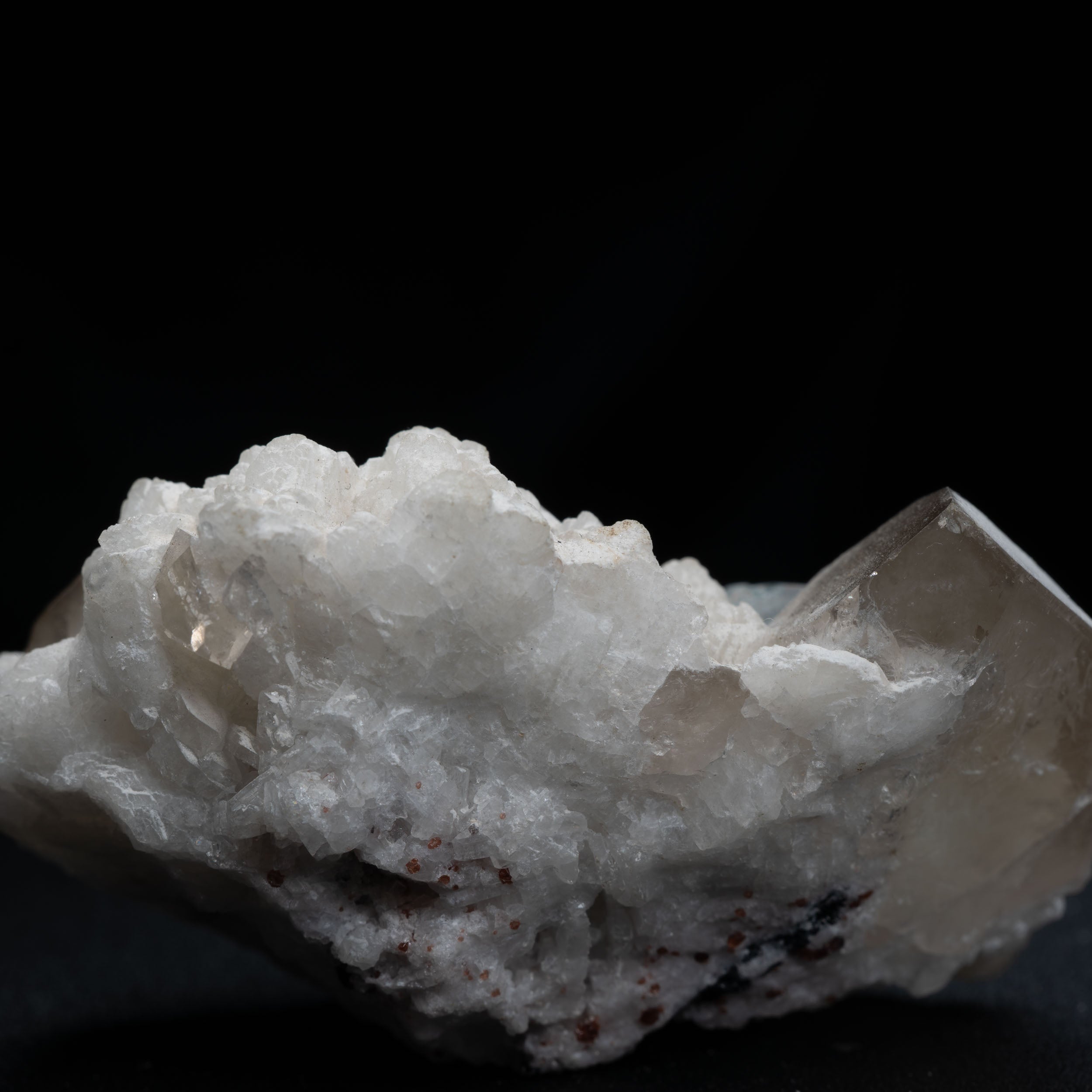 Aquamarine Nestled in Snow-White Albite with Smoky Quartz & Garnet Accents