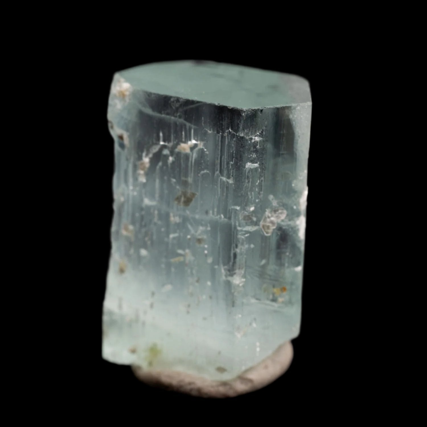 Beryl var. Aquamarine 48ct - Etched, with Muscovite