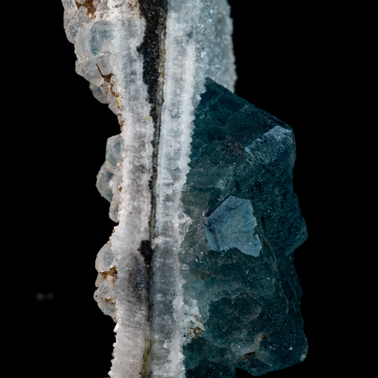 Aqua Blue Phantom Fluorite nestled on smoky crystalline Druzy matrix.