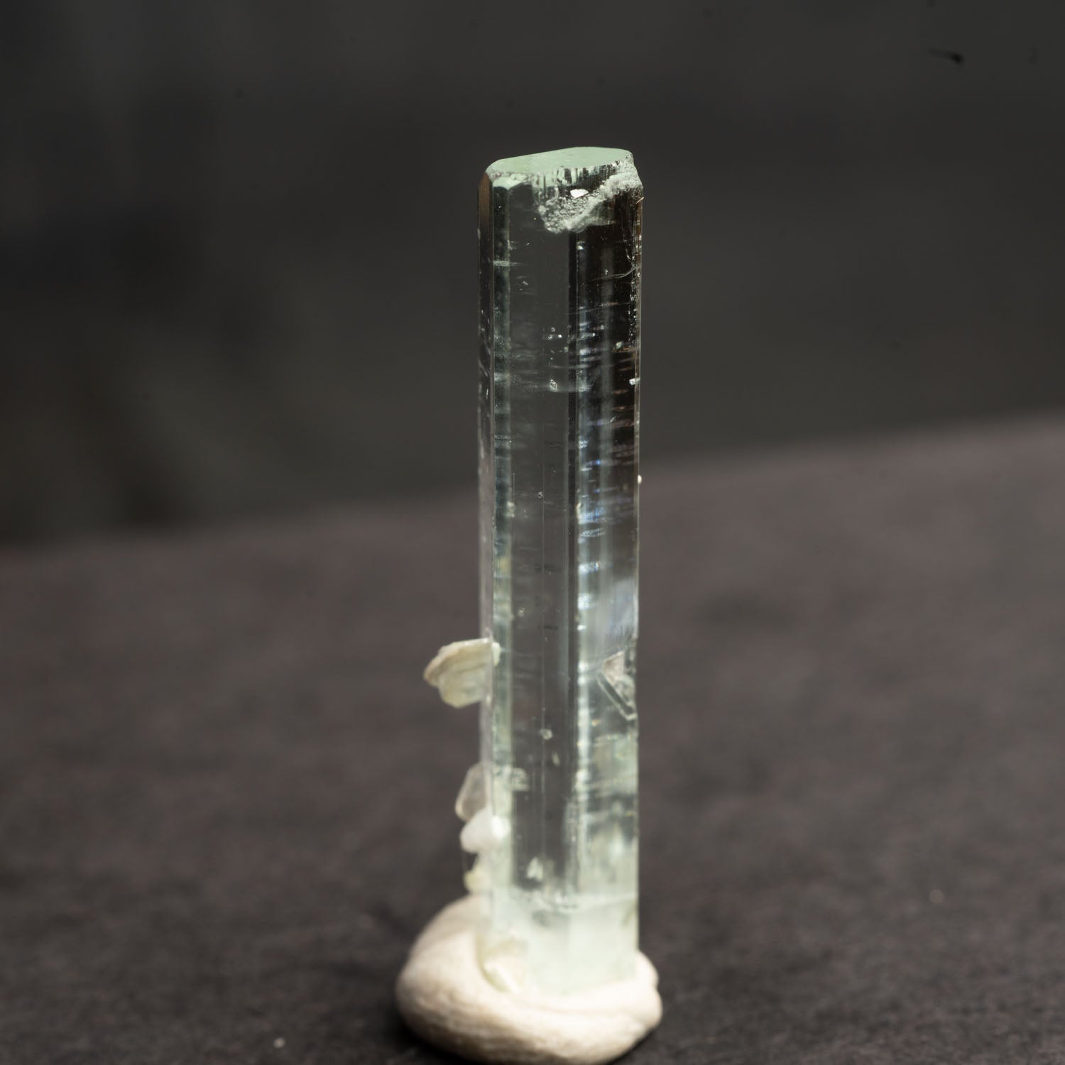 Beryl var. Aquamarine 8.6ct with Muscovite