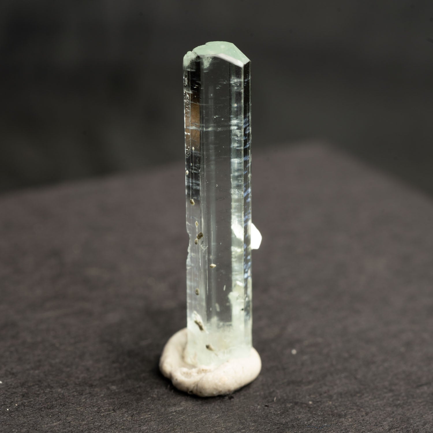 Beryl var. Aquamarine 8.6ct with Muscovite